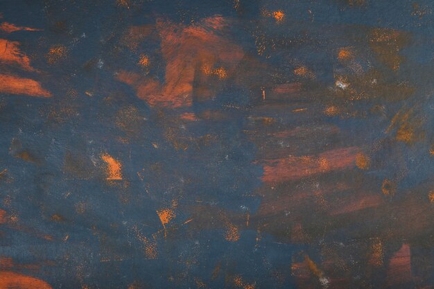 Art abstrait de marbre avec de la peinture bleue et orange.