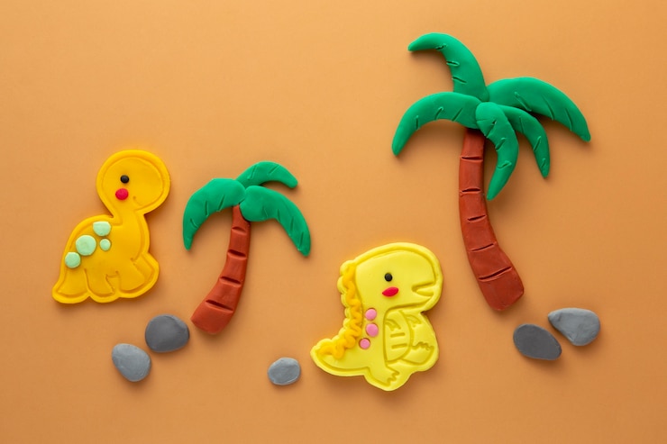 Photo gratuit art de la pâte à modeler avec des dinosaures et des palmiers