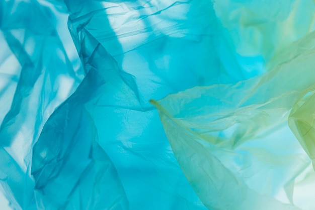 Photo gratuite assortiment à plat de sacs en plastique de différentes couleurs