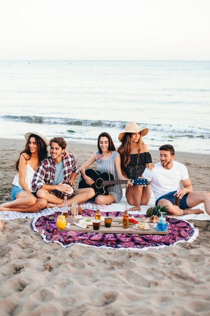 Beach party scene with friends