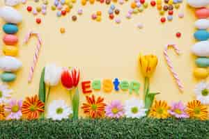 Photo gratuite bonbons lumineux et des fleurs pour les vacances de pâques