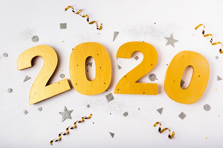 Photo gratuit bonne année avec des chiffres 2020 et des rubans