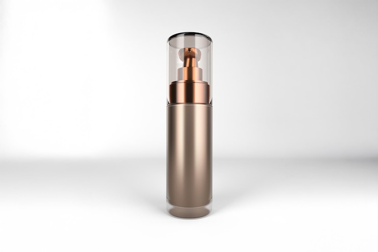 Photo gratuit bouteille cosmétique en bronze élégante avec un bouchon transparent