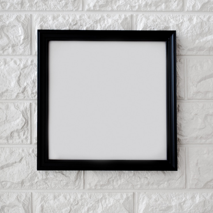 Photo gratuit cadre noir sur mur de briques blanches
