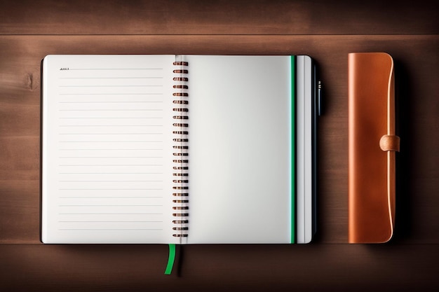 Un cahier avec une bordure verte est posé sur une table en bois.