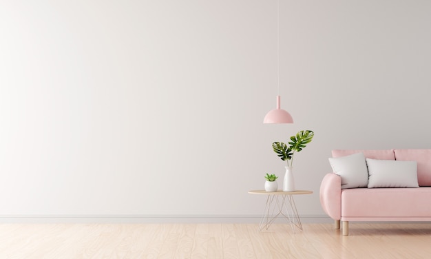 Canapé rose dans un salon blanc avec espace de copie