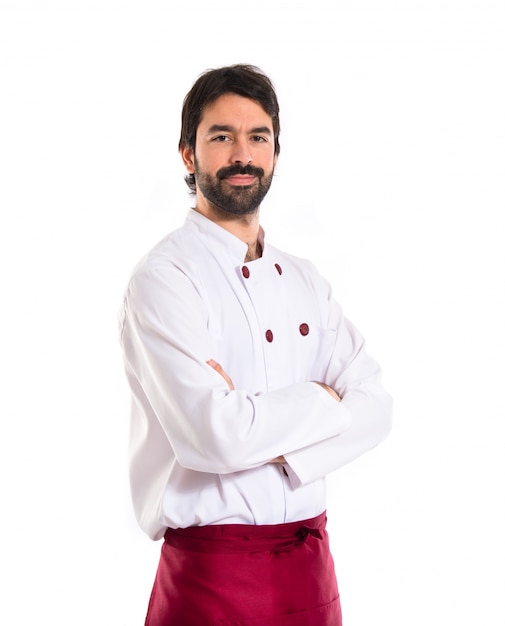 Chef avec les bras croisés sur fond blanc