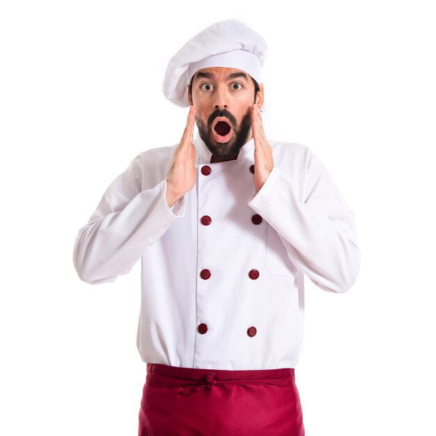 Chef faisant un geste de surprise sur fond blanc