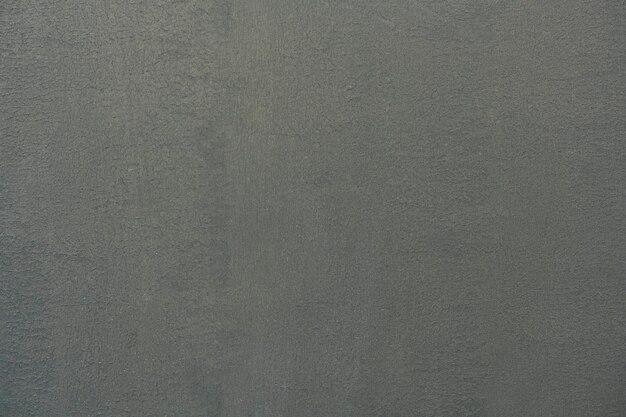 Ciment gris foncé uni texturé