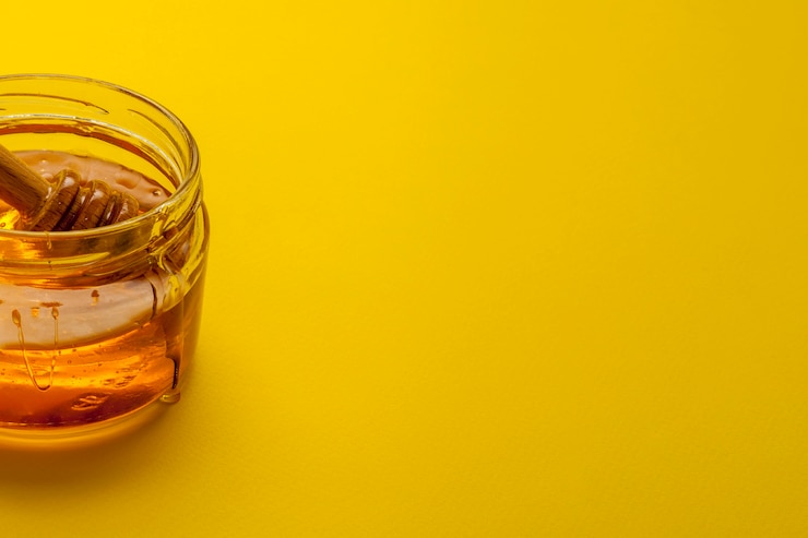 Photo gratuit close-up honey bowl avec espace de copie