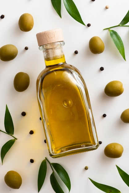 Close-up olives oil bottle on table