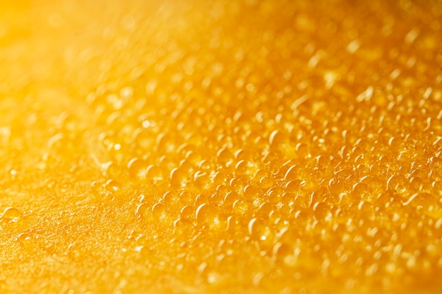 Photo gratuite close-up texture jaune avec des gouttes d'eau