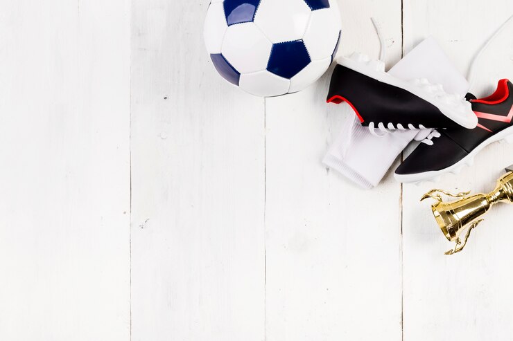 Photo gratuit composition de football avec fond