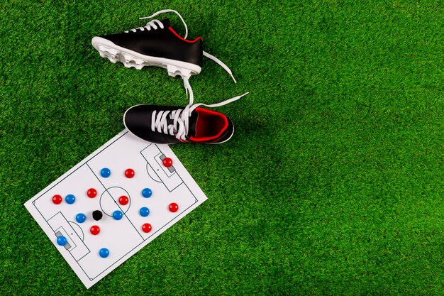 Composition de football avec planche et chaussures