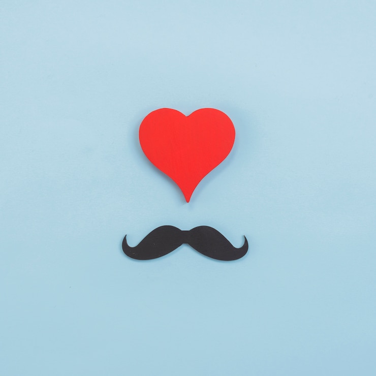 Photo gratuit composition de moustache noire et coeur rouge