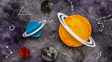 Photo gratuite composition à plat de planètes en papier créatives