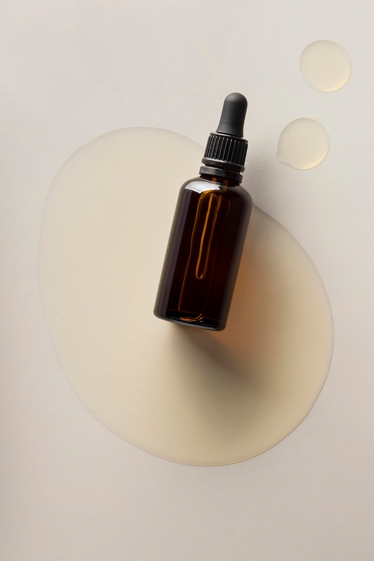 Photo gratuit composition saine d'huile de jojoba