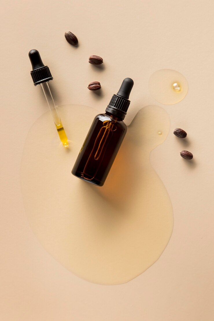 Photo gratuit composition saine d'huile de jojoba