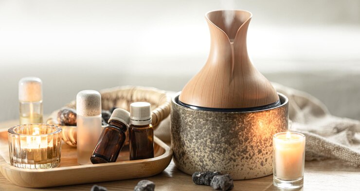 Photo gratuit composition de spa avec humidificateur d'air et huiles aromatiques
