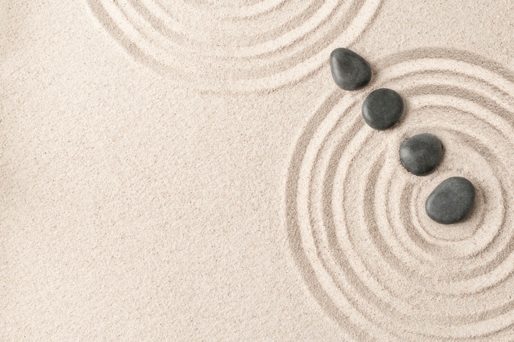 Photo gratuit concept de santé et bien-être de fond de sable de pierres zen