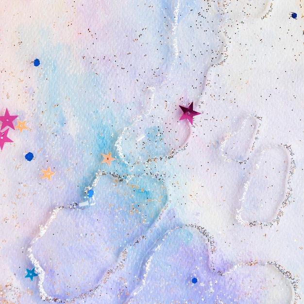 Confettis étoiles scintillantes sur fond aquarelle pastel abstrait coloré