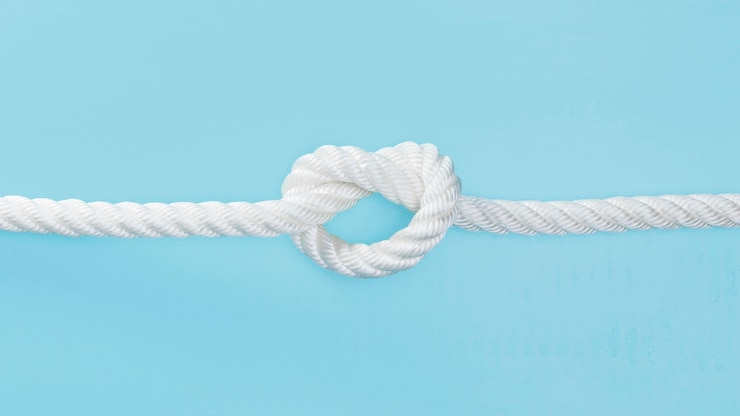 Photo gratuit corde solide blanche avec un noeud