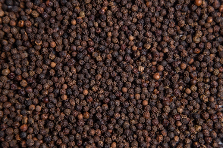 Photo gratuit cors de poivre moulu noir en arrière-plan. photo de haute qualité