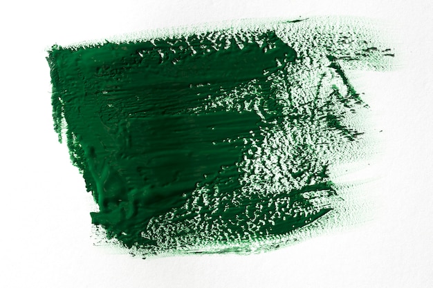 Coup de pinceau vert sur fond blanc