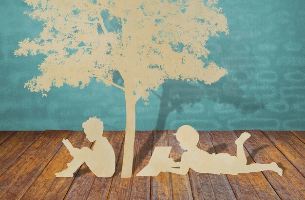 coupe de papier d&#39;enfants lire un livre sous l&#39;arbre