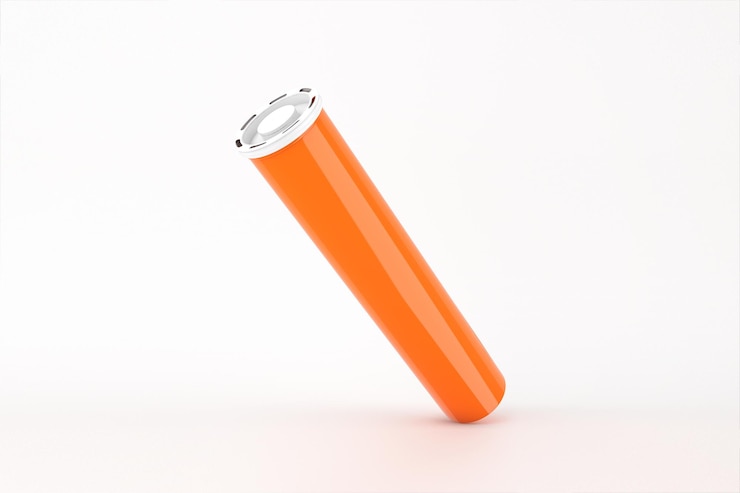 Photo gratuit cylindre orange avec un couvercle blanc isolé sur un fond blanc