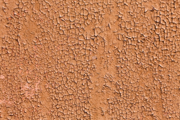 Photo gratuite découpez la peinture brune d'une texture de mur