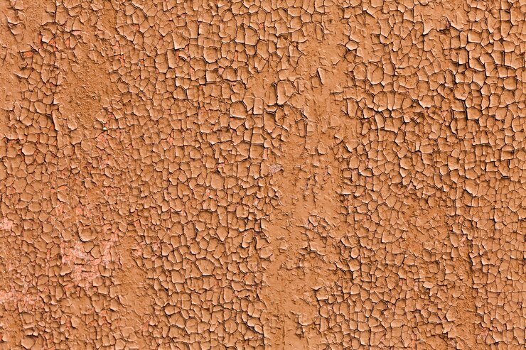 Photo gratuit découpez la peinture brune d'une texture de mur