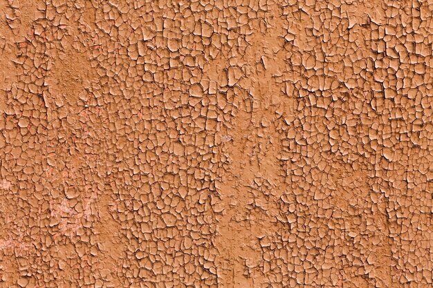 Découpez la peinture brune d'une texture de mur