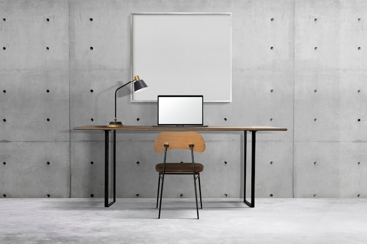 Photo gratuit design d'intérieur de bureau à domicile industriel avec cadre blanc accroché à un mur