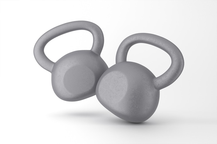 Photo gratuit deux kettlebells gris outils essentiels pour un entraînement efficace de la force et des routines de remise en forme