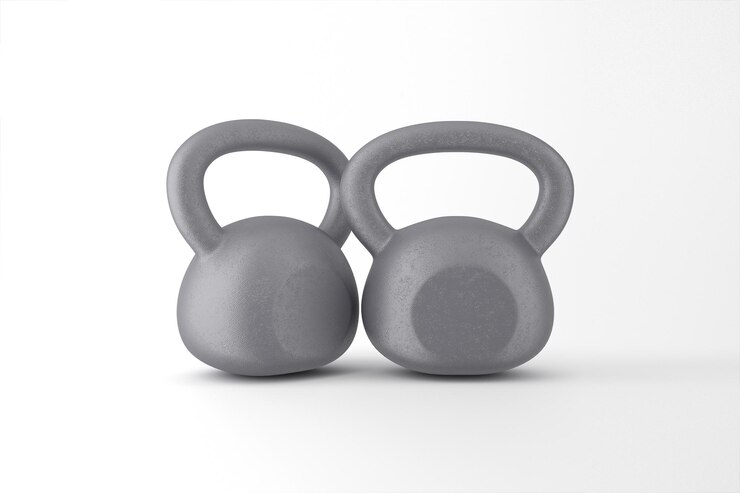 Photo gratuit deux kettlebells gris pour l'entraînement de la force et la forme physique