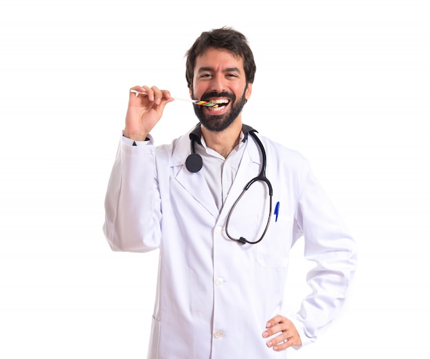 Docteur avec lolly pop sur fond blanc