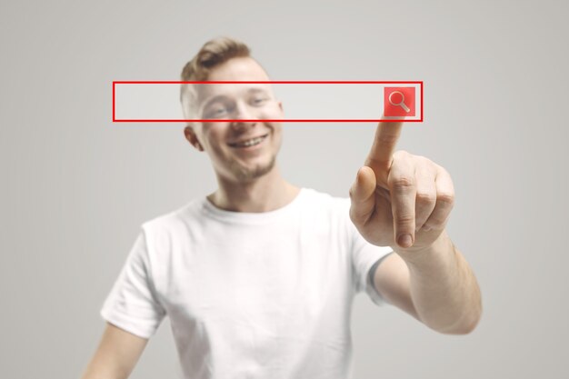 Doigt d'homme d'affaires touchant la barre de recherche vide, concept de fond de commerce moderne - peut être utilisé pour insérer du texte ou des images.
