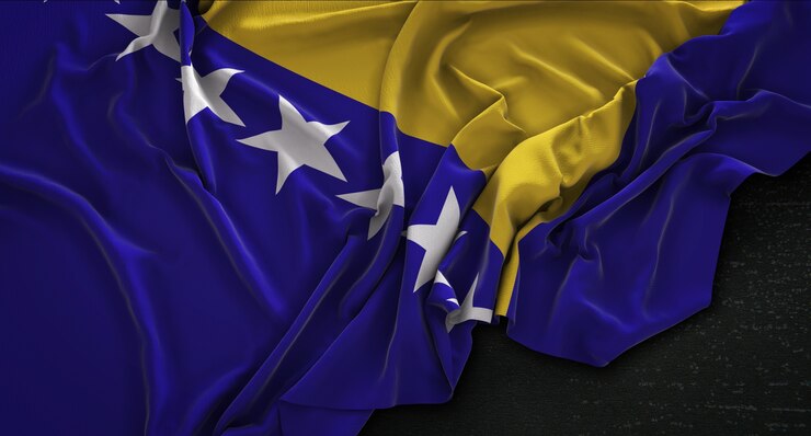 Photo gratuit drapeau de la bosnie-herzégovine enroulé sur fond sombre 3d rendre