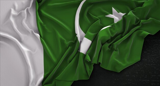 Le drapeau du Pakistan est irrégulier sur un fond sombre Rendu 3D