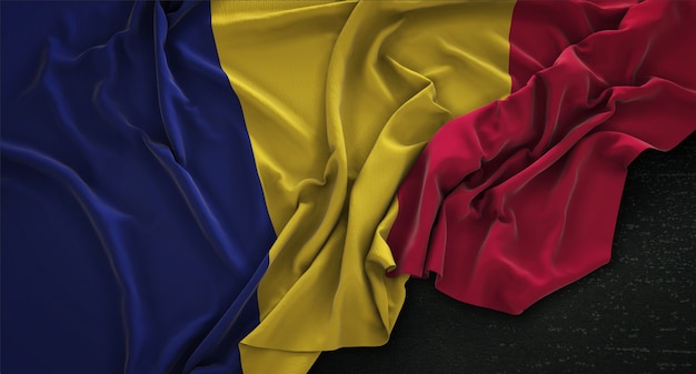 Drapeau du Tchad enroulé sur fond sombre Rendu 3D