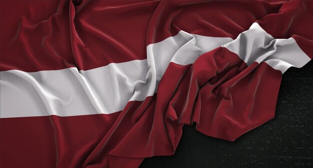 Le drapeau de Lettonie est enroulé sur un fond sombre 3D Render