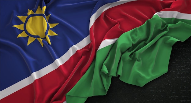 Le drapeau de la Namibie est irrégulier sur un fond sombre 3D Render