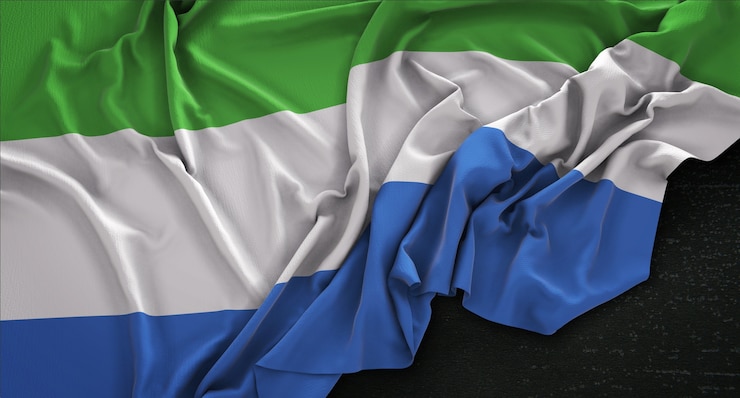 Photo gratuit drapeau de la sierra leone enroulé sur fond sombre 3d render