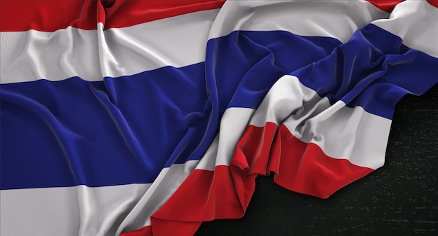 Drapeau de la Thaïlande enroulé sur fond sombre 3D Render