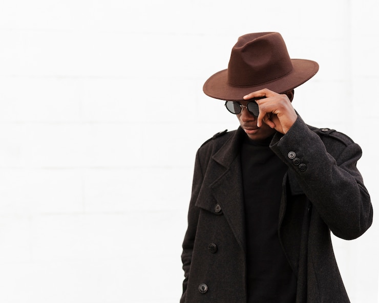 Photo gratuit élégant jeune homme avec des lunettes et un chapeau