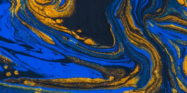 Espace abstrait bleu or fond noir peinture acrylique art fluide vagues dorées de l'océan