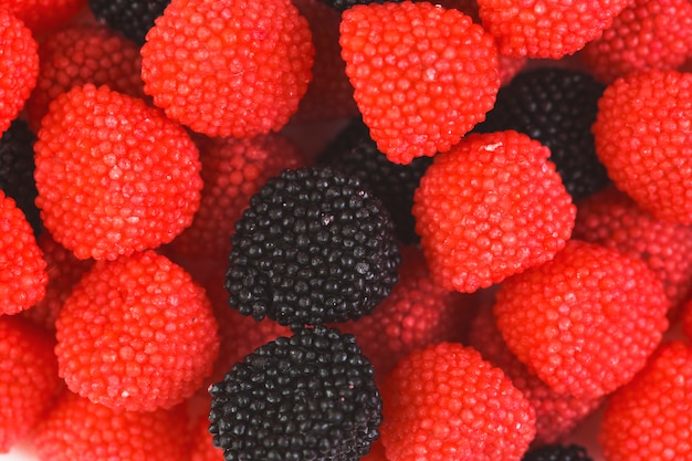 Photo gratuite extreme close-up de bonbons sucrés aux canneberges rouges et noires