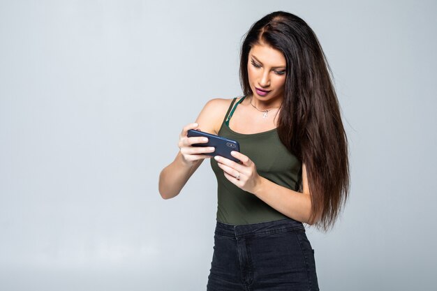 Femme, jouer, jeux, cellule, téléphone, isolé