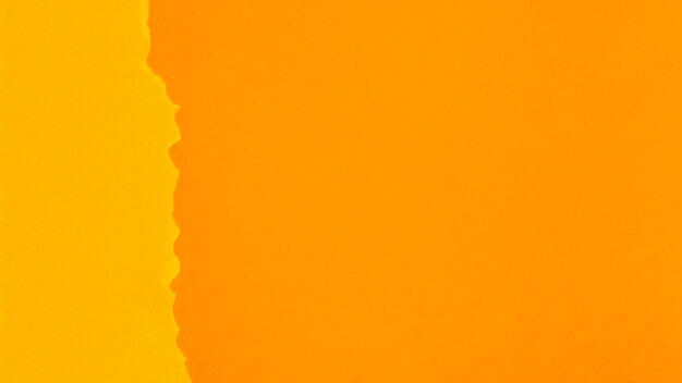 Feuilles de papier ton sur ton orange avec espace de copie
